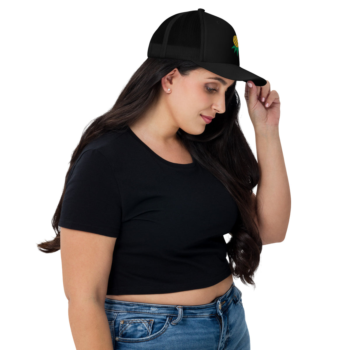 Black mesh-back trucker hat with embroidered upside-down pineapple, side view on model