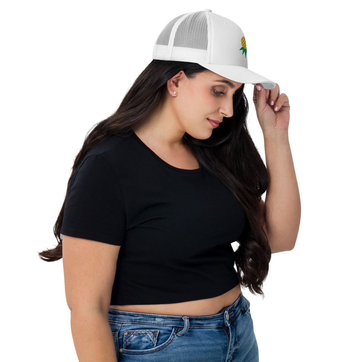 White mesh-back trucker hat with embroidered upside-down pineapple, side view on model